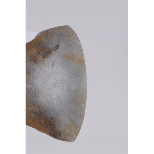 29 - A Neolithic polished hardstone axe head, 8 x 5cm