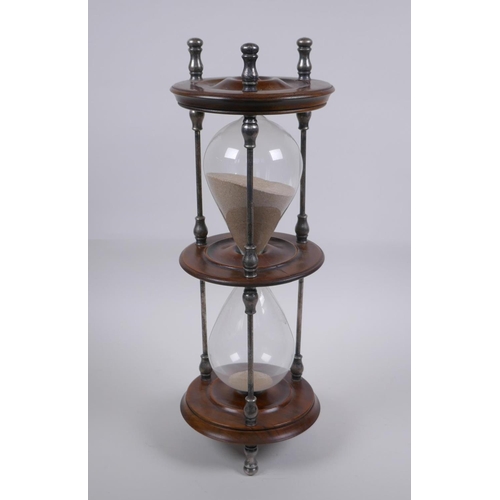 34 - An antique silver plate and turned wood hour glass sand timer, 37cm high x 13cm diameter