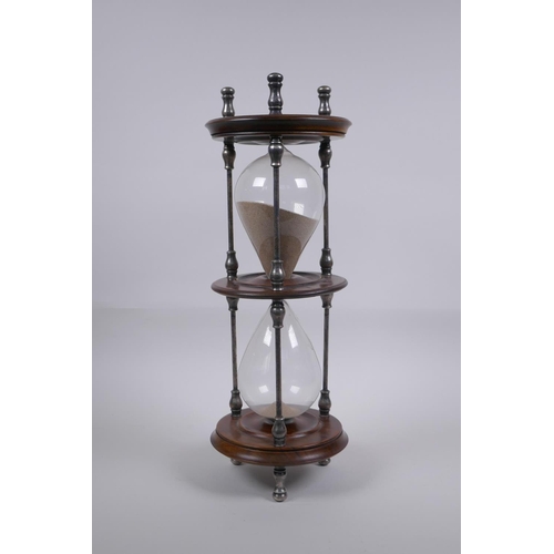 34 - An antique silver plate and turned wood hour glass sand timer, 37cm high x 13cm diameter