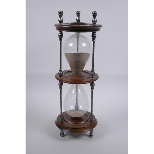 34 - An antique silver plate and turned wood hour glass sand timer, 37cm high x 13cm diameter