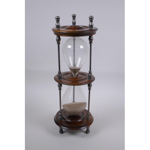 34 - An antique silver plate and turned wood hour glass sand timer, 37cm high x 13cm diameter