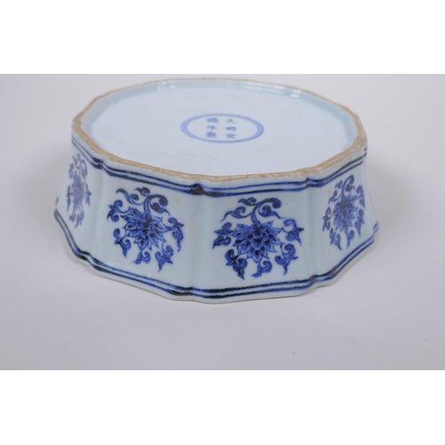 45 - A blue and white porcelain steep sided dish with lobed rim and lotus flower decoration, Chinese Xuan... 