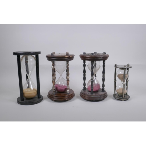 46 - A pair of vintage silver plated and turned wood hourglass sand timers with white metal decoration to... 