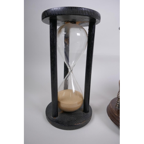 46 - A pair of vintage silver plated and turned wood hourglass sand timers with white metal decoration to... 