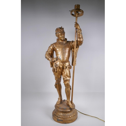 49 - A gilt spelter figural lamp in the form of a Renaissance gentleman, 86cm high