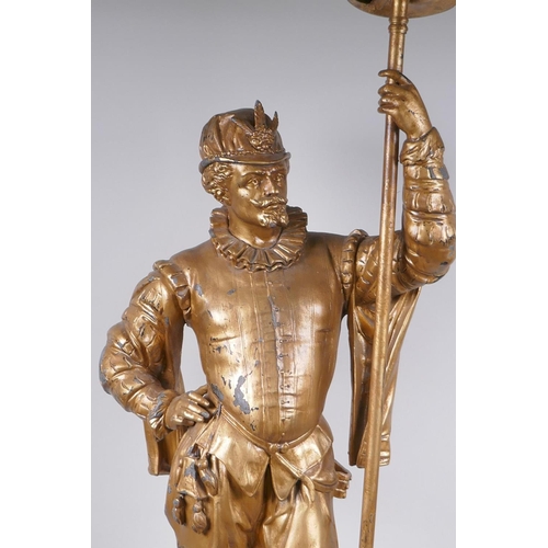 49 - A gilt spelter figural lamp in the form of a Renaissance gentleman, 86cm high