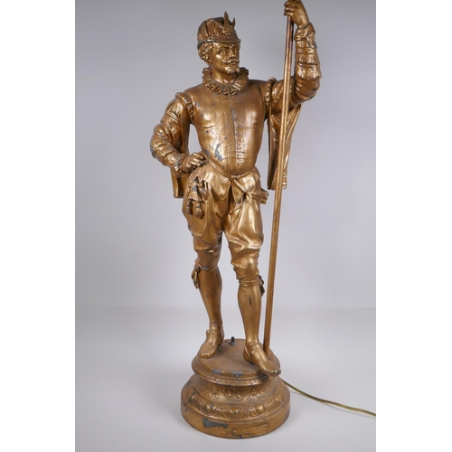 49 - A gilt spelter figural lamp in the form of a Renaissance gentleman, 86cm high