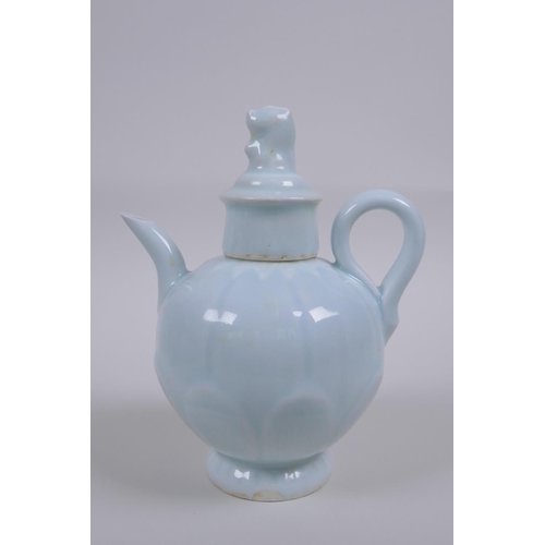 50 - A Chinese pale blue glazed porcelain teapot of lotus flower form, 16cm high