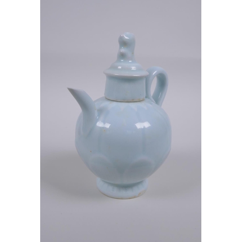 50 - A Chinese pale blue glazed porcelain teapot of lotus flower form, 16cm high