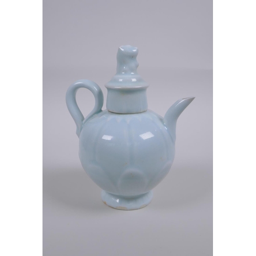 50 - A Chinese pale blue glazed porcelain teapot of lotus flower form, 16cm high