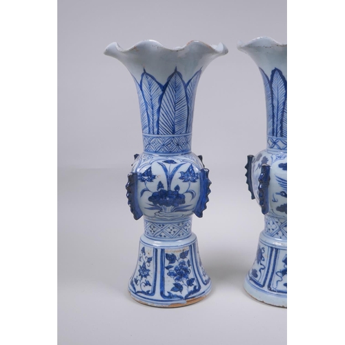 53 - A pair of Chinese Ming style blue and white porcelain gu shaped vases with phoenix and lotus flower ... 