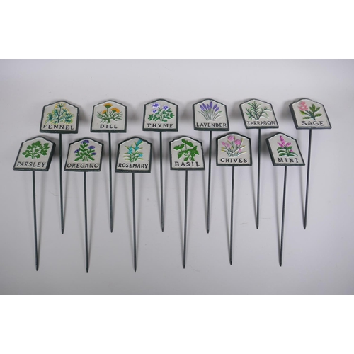 54 - A set of twelve painted cast iron herb markers, 27 cm long