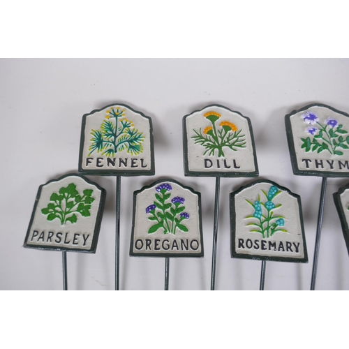 54 - A set of twelve painted cast iron herb markers, 27 cm long