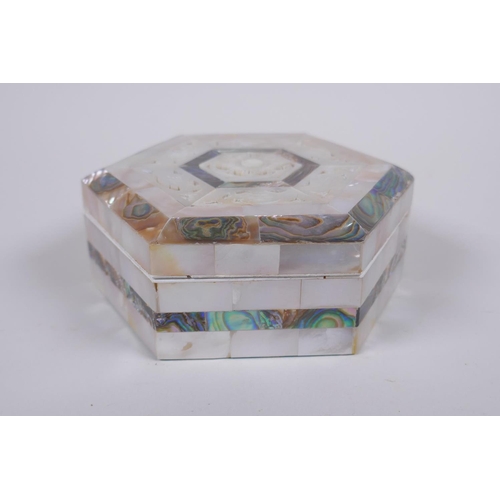 59 - A mother of pearl abalone hexagonal trinket box, 12cm diameter