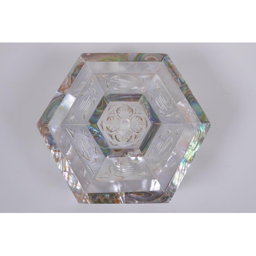 59 - A mother of pearl abalone hexagonal trinket box, 12cm diameter