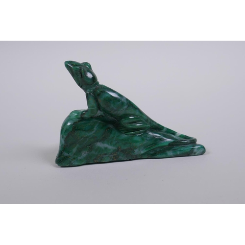 68 - A Chinese marbled green hardstone carving of a lizard on a rock, 9cm long