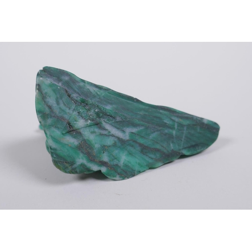 68 - A Chinese marbled green hardstone carving of a lizard on a rock, 9cm long