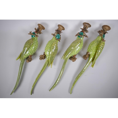 69 - Two pairs of polychrome porcelain and gilt metal parrot sconces, 47cm long