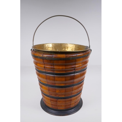 72 - A Dutch coopered fruitwood and brass lined peat bucket with ebonised bands, 32cm high x 29cm diamete... 