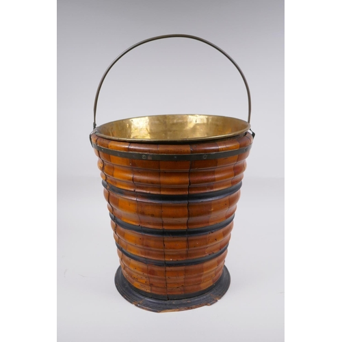 72 - A Dutch coopered fruitwood and brass lined peat bucket with ebonised bands, 32cm high x 29cm diamete... 