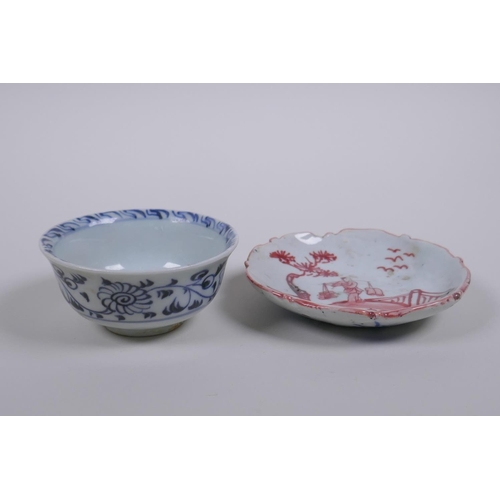 73 - A Chinese Ming style blue and white porcelain tea bowl and red and white porcelain saucer with shape... 