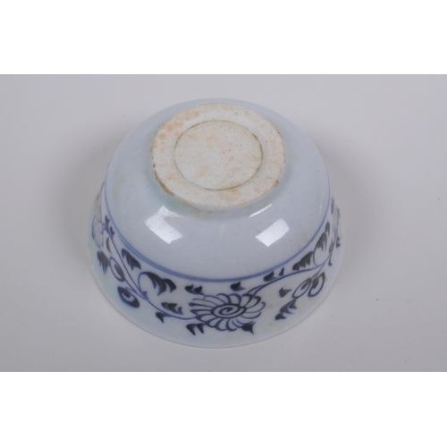 73 - A Chinese Ming style blue and white porcelain tea bowl and red and white porcelain saucer with shape... 