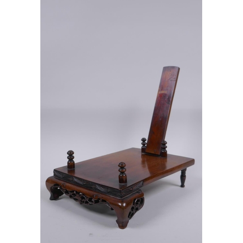 74 - A collection of nine antique Chinese carved and pierced hardwood stands, largest 20 x 16cm