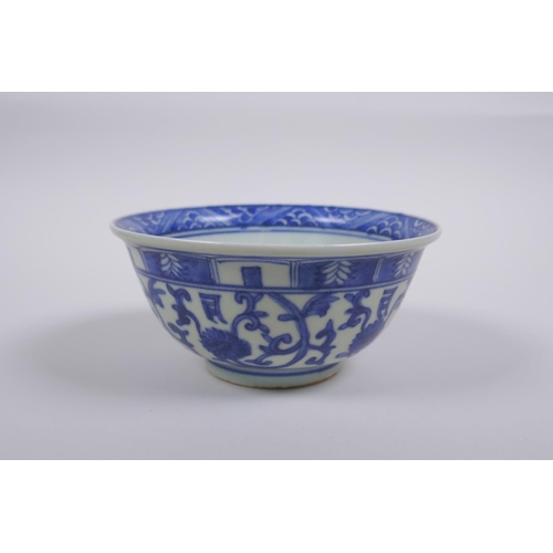 75 - A Chinese blue and white porcelain rice bowl with script and lotus flower decoration, 13cm diameter