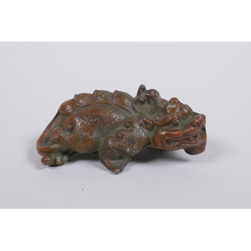 76 - An oriental bronze kylin, 9cm long