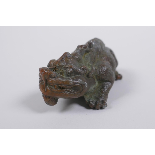 76 - An oriental bronze kylin, 9cm long