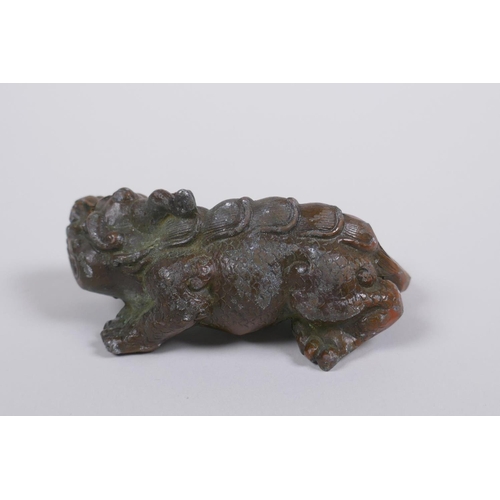 76 - An oriental bronze kylin, 9cm long