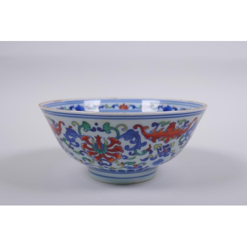 78 - A Chinese wucai porcelain rice bowl decorated with bats and lotus flowers, YongZheng 6 character mar... 