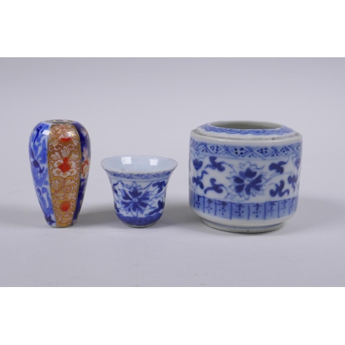 79 - A Chinese blue and white porcelain cylinder pot, a miniature porcelain tea bowl, and a miniature por... 