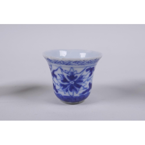 79 - A Chinese blue and white porcelain cylinder pot, a miniature porcelain tea bowl, and a miniature por... 