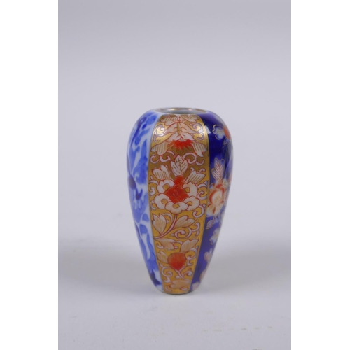 79 - A Chinese blue and white porcelain cylinder pot, a miniature porcelain tea bowl, and a miniature por... 