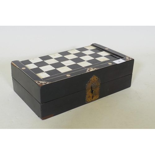 8 - A C19th ebony and ivory and stained bone games box, with chequer board top and backgammon interior, ... 