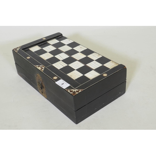 8 - A C19th ebony and ivory and stained bone games box, with chequer board top and backgammon interior, ... 