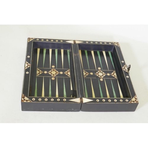 8 - A C19th ebony and ivory and stained bone games box, with chequer board top and backgammon interior, ... 