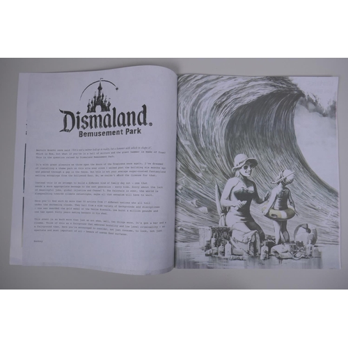 825 - Banksy, Dismaland Bemusement Park Program, and an Action Man 'Dead Action Man' flyer, 29 x 34cm