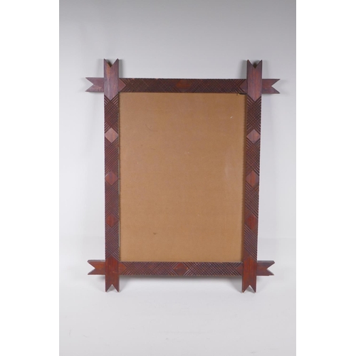 839 - An Italian tramp art pine picture frame, 36 x 48cm rebate