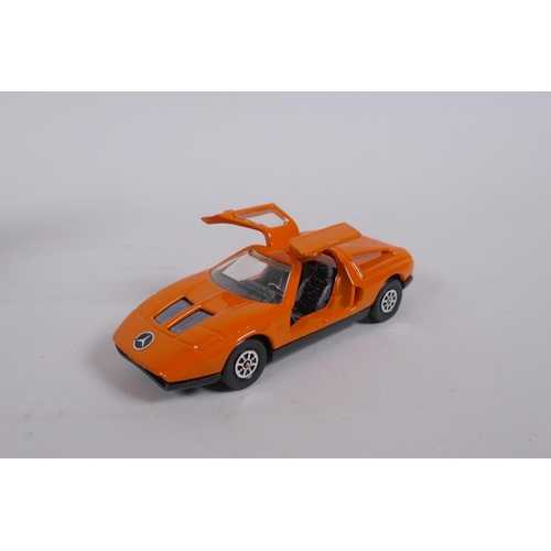 91 - Corgi 388 Mercedes Benz C111, Whizzwheels in original box, a Corgi 341 Mini Marcos GT850, with take-... 