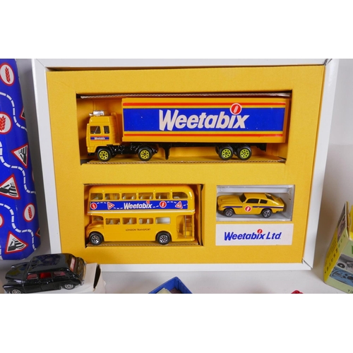 97 - A Special Edition Weetabix Corgi Collection Box containing an Aston Martin DB6, a London bus and an ... 