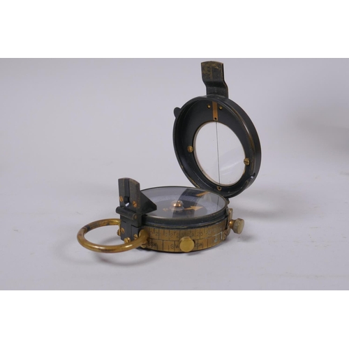 137 - A pair of WWI binoculars with leather case, and a British Army WWI Verners Mk. VII marching compass ... 