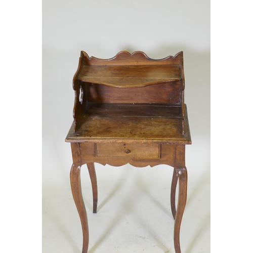 1115 - An early C19th French fruitwood single drawer side table with shaped gallery and pierced sides, rais... 