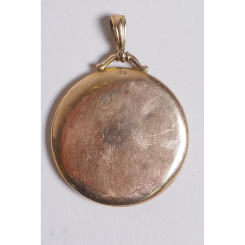 654 - A yellow metal circular locket, marks rubbed, probably 9ct, 7.7g, on a 14ct gold plated chain, 4cm d... 