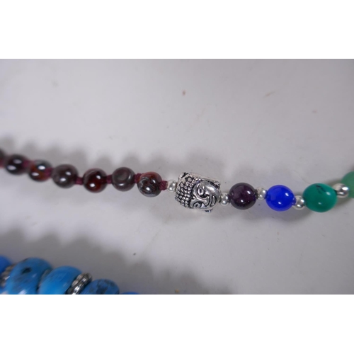 663 - A string of blue and red glass mala beads, a string of tiger's eye mala beads, a string of dried bea... 