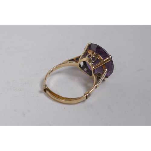 659 - A vintage 9ct gold dress ring set with a large amethyst, size Q, 6g gross