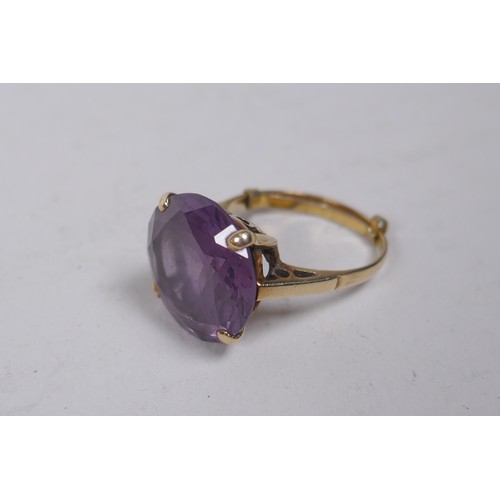 659 - A vintage 9ct gold dress ring set with a large amethyst, size Q, 6g gross