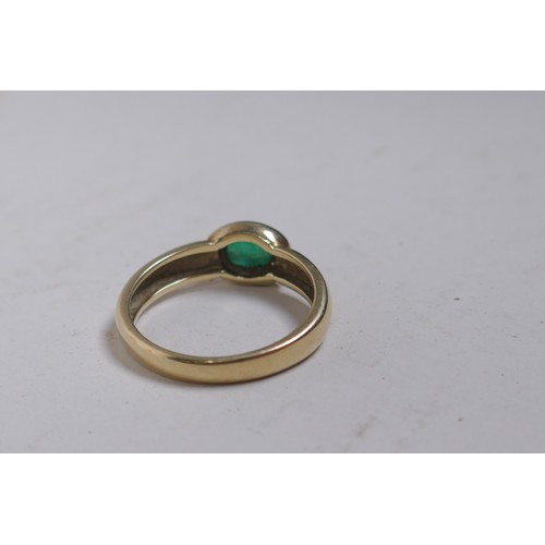 660 - A 9ct gold ring set with a green crystal stone, size P, 3.1g gross