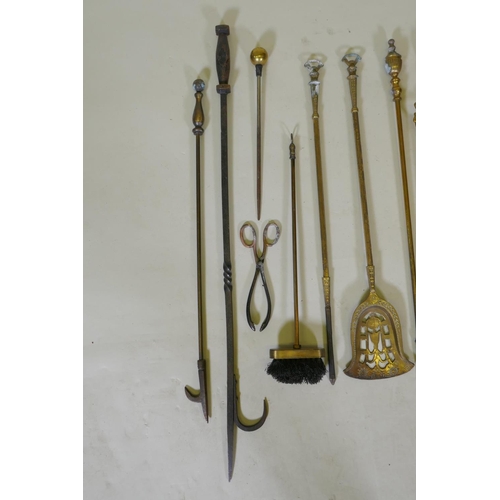 321 - A set of three brass Empire style fire irons and a quantity of other fire irons including a wrought ... 